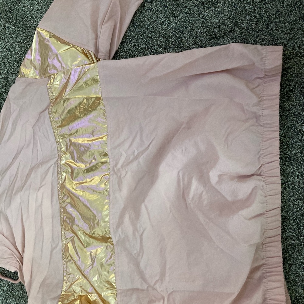 Pink windbreaker. Size large.